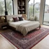 Peaceful primary bedroom with a mid-century walnut bed frame and beige linens, anchored by an intricate red Kashan Persian rug.