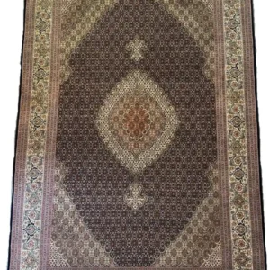Full overhead view of a 4' 7" x 9' 11" hand-knotted Iranian Mahi wool rug featuring a repeating geometric fish pattern in dark brown and ivory white.