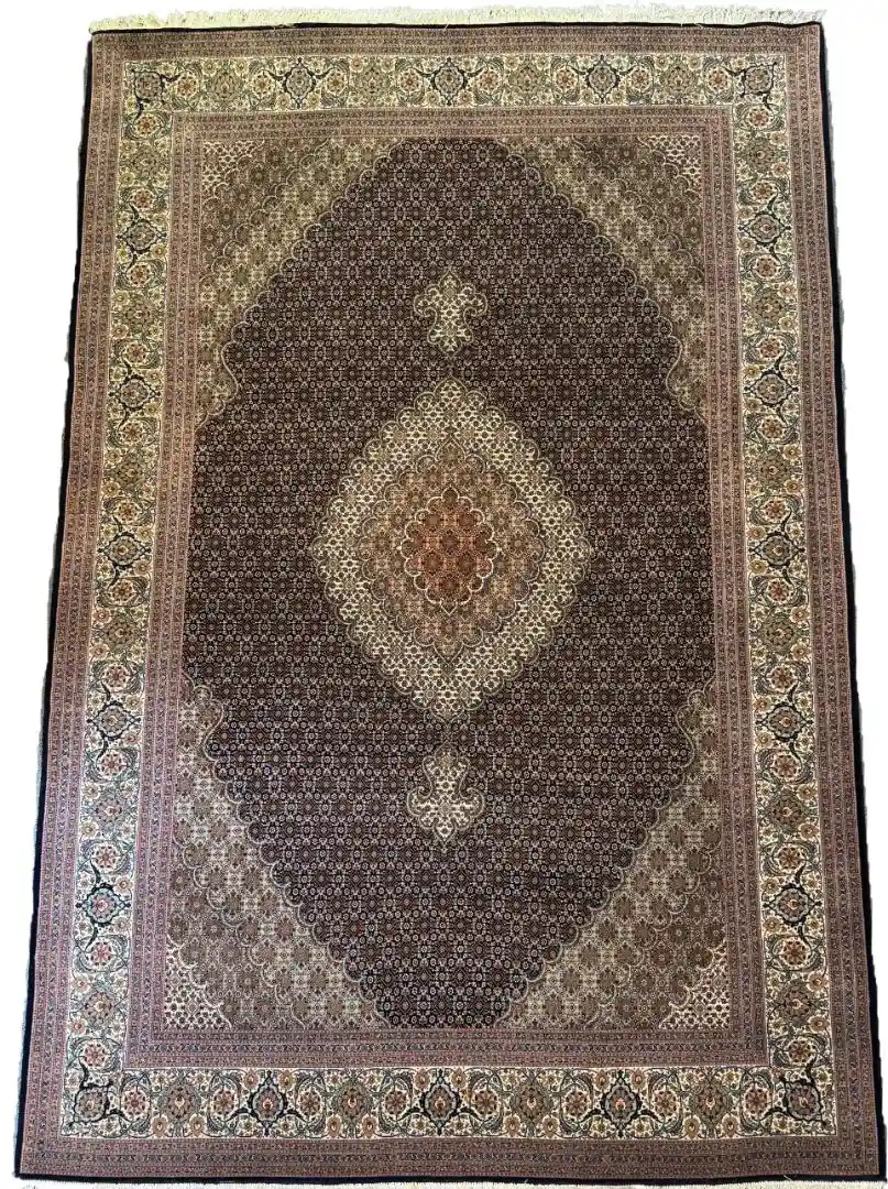 Full overhead view of a 4' 7" x 9' 11" hand-knotted Iranian Mahi wool rug featuring a repeating geometric fish pattern in dark brown and ivory white.