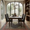 Sophisticated dining room featuring a long wooden table and beige upholstered chairs, centered over an intricate 6x10 blue and orange Mahi area rug under arched windows.