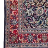 Detailed corner view of a navy and red Persian Mood rug showing the ornate multi-layered border and secure hand-bound edges.