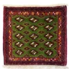 Overhead view of a 1' 10" x 1' 8" hand-knotted Iranian Persian wool rug featuring a vibrant green field with repeating tribal motifs and a deep red geometric border.