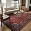 Luminous contemporary living room with a beige sofa and glass coffee table, anchored by a 7x10 red and indigo Sarough Persian rug.