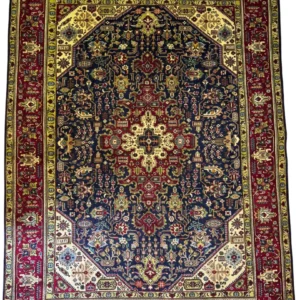 Full overhead view of a 6' 10" x 9' 6" hand-knotted Iranian Tabriz wool rug with an intricate central medallion on a warm camel and soft red field.