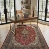 Professional home workspace with a walnut desk and tan leather chair, centered over an intricate 7x10 red Tabriz Persian wool rug.