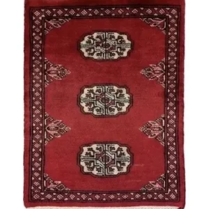 Overhead view of a 1' 6" x 1' 11" hand-knotted Pakistan Bokhara wool rug featuring a deep red field and three central ivory gul medallions.