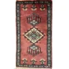 Overhead view of a 1' 0" x 2' 0" hand-knotted Pakistan Jaldar wool rug featuring a rose-terracotta field with three geometric diamond medallions.