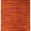 Overhead view of a 1' 3" x 2' 0" tufted Indian wool rug featuring a vibrant, solid sunset-orange color with a deep, shaggy texture.