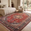 Peaceful master bedroom featuring a walnut bed frame and beige linens, anchored by an intricate red Sabzevar Persian rug on light hardwood floors.