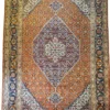 Full overhead view of a 6' 9" x 10' 2" hand-knotted Persian Mahi fish wool rug featuring a terraced central diamond medallion on a rust-orange field.
