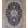 Full overhead view of a 6' 9" x 10' 4" hand-knotted Persian Nain wool rug featuring a floral medallion on a dark navy field with ivory borders.