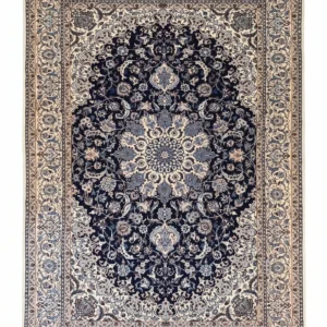 Full overhead view of a 6' 9" x 10' 4" hand-knotted Persian Nain wool rug featuring a floral medallion on a dark navy field with ivory borders.