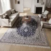 Hand-knotted 6' 9" x 10' 4" Persian Nain wool rug styled in a modern minimalist living room with a cream sofa and fireplace.