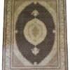Full overhead view of a 6' 5" x 9' 10" hand-knotted Persian Mahi fish wool rug featuring an oval dark espresso field with an intricate multi-tiered cream and gold medallion.