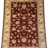 Full overhead view of a 6' 8" x 9' 7" hand-knotted Afghan Chobi wool rug with an all-over floral palmette motif on a rich red field and cream border.