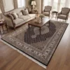Hand-knotted India Mahi wool rug 6' 9" x 10' 2" styled in an upscale living room under a wooden coffee table and cream linen sofa.