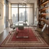 ed and cream Indian wool rug styled in a high-rise executive office under a glass writing desk and modern mesh chair.