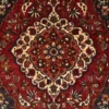 Close-up of the scalloped central medallion, floral palmettes, and durable wool pile on a Persian Bakhtiar rug.