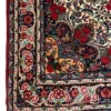 Detailed corner view of a Persian Bijar wool area rug showing ornate floral borders, corner spandrels, and fringe.
