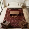 Persian Hoseinabad wool rug styled in a light-filled living room under a wooden coffee table, cream sofa, and brown leather armchairs.
