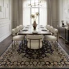 Persian Najafabad wool area rug placed beneath a long walnut dining table with eight cream bouclé chairs and a modern chandelier.