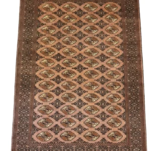 Full overhead view of a 6' 6" x 9' 2" hand-knotted Persian Turkaman wool rug featuring a dusty rose field with repeating geometric gul medallions.