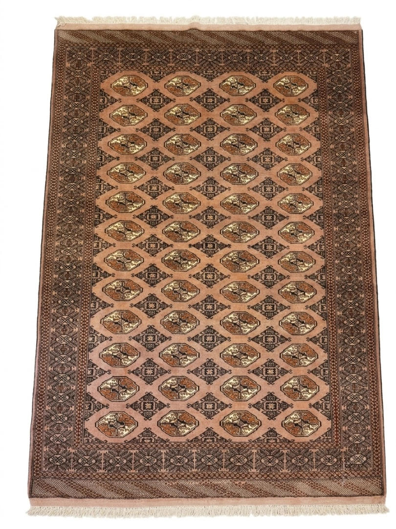 Full overhead view of a 6' 6" x 9' 2" hand-knotted Persian Turkaman wool rug featuring a dusty rose field with repeating geometric gul medallions.