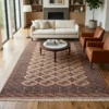 6' 6" x 9' 2" Persian Turkaman wool rug styled in a modern living room with a round marble coffee table and leather chairs.