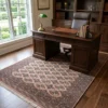 Persian Turkaman wool carpet styled in a classic executive study under a dark wood desk and leather chair.