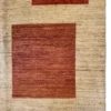 Detailed corner view of an Afghan Choobi wool rug displaying warm terracotta color blocks against an oatmeal-beige wool pile.