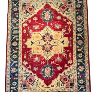 Full overhead view of a 6' 0" x 9' 0" hand-knotted Afghan Kazak wool rug featuring a large stepped ivory-gold medallion on a rich red field with a deep navy border.