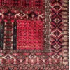 Detailed corner view of an Afghan Torkman wool rug showing the serrated diamond border, square meander guard stripes, and flat-woven skirt.