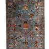 Full overhead view of a 3' 4" x 5' 0" hand-knotted Afghan Uzbek wool rug featuring a denim blue field with pomegranate and floral tree motifs and matching blue border.
