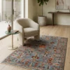 3' 4" x 5' 0" Afghan Uzbek wool rug styled in a modern reading corner under a curved cream bouclé armchair and marble side table.