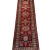 Full overhead view of a 2' 6" x 10' 0" hand-knotted Afghan Kazak wool runner rug featuring a vertical sequence of geometric diamond and octagonal tribal medallions on a rich crimson red field.
