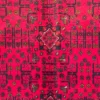 Close-up of stepped diamond guls, geometric floral branches, and plush hand-spun wool pile on a vibrant red Afghan Torkman rug