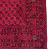 Detailed corner view of an Afghan Torkman wool rug showing the multi-band geometric border, octagonal cartouches, and fringe.