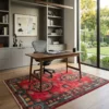 Hand-knotted Afghan Uzbek wool rug placed under a sleek walnut writing desk and ergonomic chair in a modern home office.