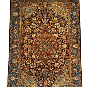 Full overhead view of a 4' 3" x 6' 6" hand-knotted Persian Isfahan wool and silk rug with a cognac medallion, midnight blue floral field, and turquoise-blue Shah Abbas border.