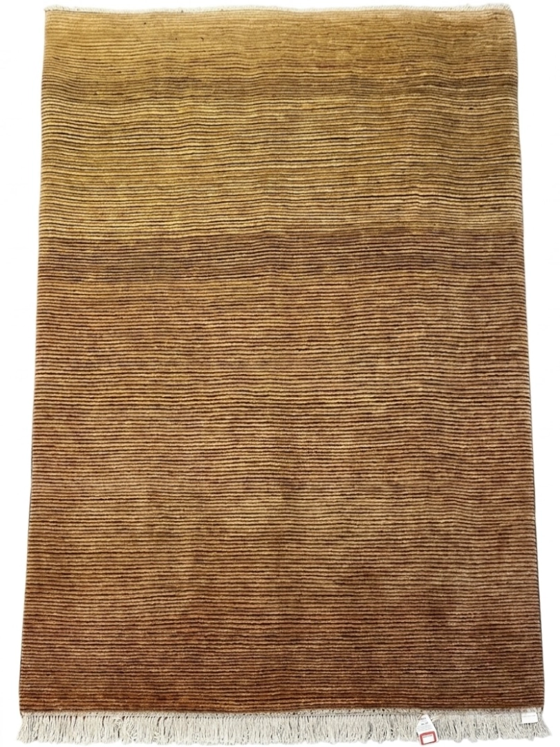 Full overhead view of a 6' 7" x 9' 8" hand-knotted Afghanistan Gabbeh wool rug featuring a minimalist ribbed texture with natural tan, mustard, and golden-brown abrash color gradient.
