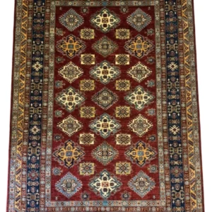 Full overhead view of a 6' 11" x 9' 10" hand-knotted Afghanistan Kazak wool rug with a rich rust-red field, geometric medallions, and a navy blue border.