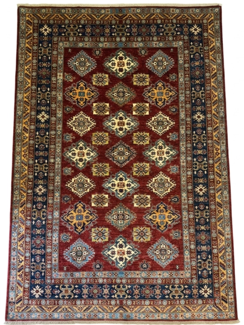 Full overhead view of a 6' 11" x 9' 10" hand-knotted Afghanistan Kazak wool rug with a rich rust-red field, geometric medallions, and a navy blue border.