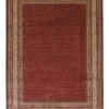 Full overhead view of a 6' 9" x 9' 8" hand-knotted Indian wool rug featuring an all-over repeating micro-boteh floral pattern on a rich brick red field and a cream border.