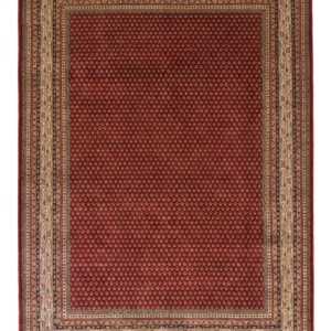 Full overhead view of a 6' 9" x 9' 8" hand-knotted Indian wool rug featuring an all-over repeating micro-boteh floral pattern on a rich brick red field and a cream border.