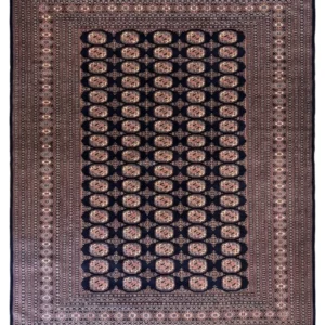 Full overhead view of a 7' 3" x 9' 11" hand-knotted Pakistan Bokhara wool rug featuring a dark navy field with repeating oval gul motifs and a wide geometrically patterned border.