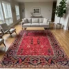 8' 0" x 10' 0" Afghan Bakhtiar wool rug anchoring a grand open-concept living room with a wood coffee table, cream sofa, and accent chairs.