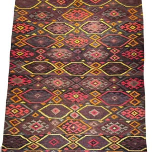 Full overhead view of a 7' 0" x 12' 0" hand-knotted Afghan Kilim wool rug featuring an all-over repeating diamond lattice with tribal eye and geometric motifs in charcoal, burgundy, ochre yellow, and coral red.