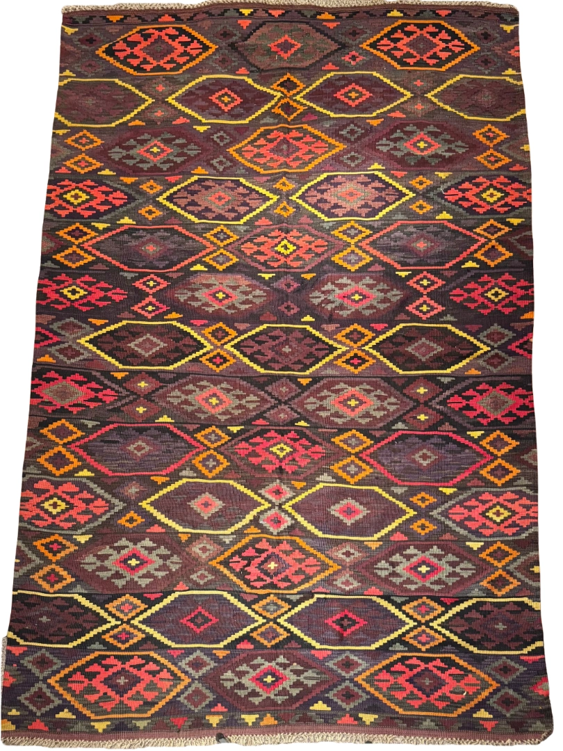 Full overhead view of a 7' 0" x 12' 0" hand-knotted Afghan Kilim wool rug featuring an all-over repeating diamond lattice with tribal eye and geometric motifs in charcoal, burgundy, ochre yellow, and coral red.