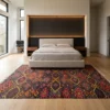 Afghan Kilim wool rug positioned at the foot of an upholstered bed in a minimalist bedroom with accent lighting and floor-to-ceiling windows